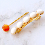 Machen Sie mit Kauri Muscheln farbenfrohen Schmuck und so tragen Sie Sommer Haaraccessoires: